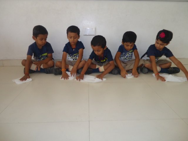 Napkin folding - Napkin folding is a form of art .It is a life skill activity which we use in day  - to -day life.Children learnt to fold napkins beautifully and they enjoyed the activity.